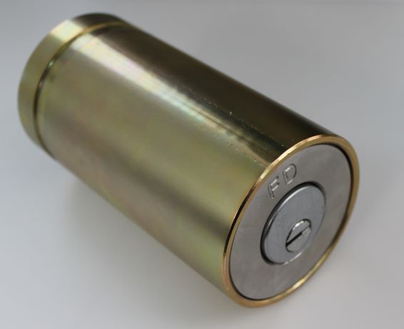 Side view of an engraved cylindrical lock box